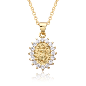 Macro view of 18k gold plated Virgin Mary pendant with sparkling zircon accents