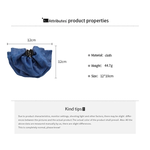 Detail view of denim blue fabric hair claw clip showing size dimensions of 12 by 10 cm