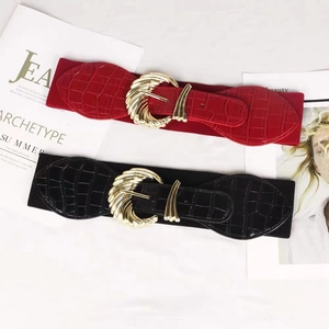 Wide elastic waist belt set in red and black with croc-embossed leather and gold buckle