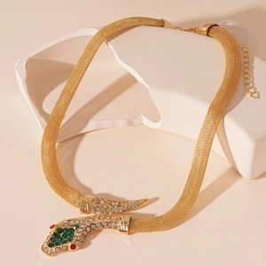 Detailed view of golden snake necklace with woven mesh chain and colorful rhinestones