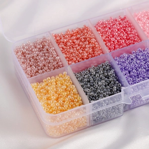 Macro shot of colorful macaron frosted glass seed beads set in a plastic organizer box