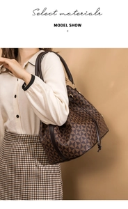 Close-up of geometric pattern bucket bag with drawstring closure on model's shoulder