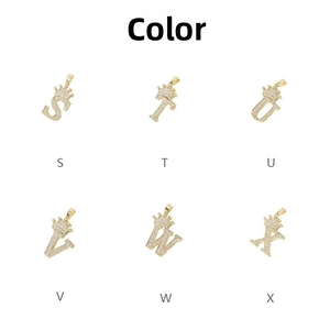 Detail view of gold-plated crown alphabet pendants S to X with micro-pave zircons