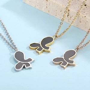 Minimalist butterfly necklaces in gold silver and rose gold with black shell pendants