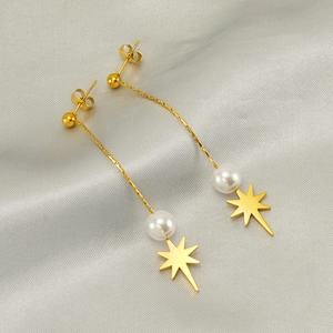 Elegant gold-tone long tassel star earrings featuring white pearls and polished star pendants