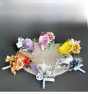 Top view of handmade PU calla lily boutonnieres in various colors on a straw mat