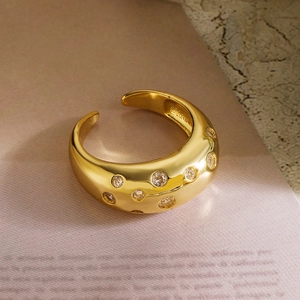 Elegant gold plated open ring with cubic zirconia stones in a minimalist design