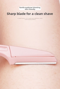 Close-up of pink eyebrow razor with fine serrated metal blade on skin for precise trimming