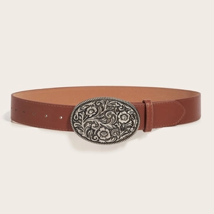 Vintage brown leather belt with engraved silver oval buckle on a neutral background