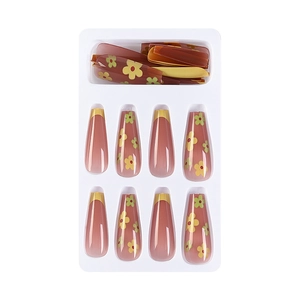 French tip press-on nails with red base and floral patterns in long trapezoid shape