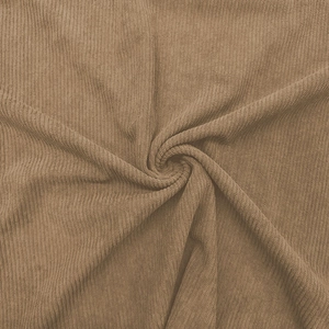 Close-up of brown corduroy fabric texture with vertical stripes on long sleeve Polo shirt