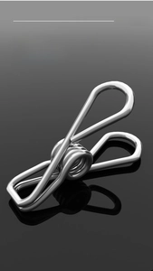 Close-up of integrated molding stainless steel spring clips for drying socks and laundry