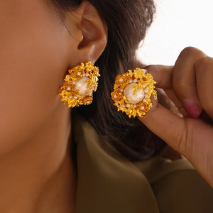 Baroque pearl flower stud earrings in vintage gold finish with embossed floral petals