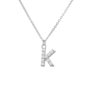 Detailed close-up of a silver-toned letter K necklace pendant with elegant pearl inlays