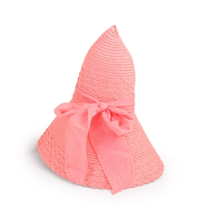 Close-up of pink woven sun hat featuring a delicate chiffon bow and textured wavy brim