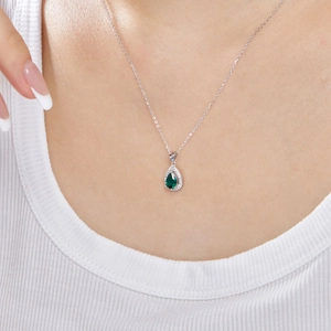 S925 sterling silver necklace with green pear-cut zircon shown on a model's collarbone