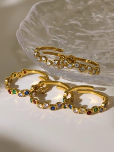 Detail of adjustable open rings with colorful cubic zirconia in 18k gold plating