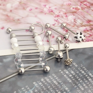 Detailed macro view of assorted stainless steel tongue rings and barbell body jewelry