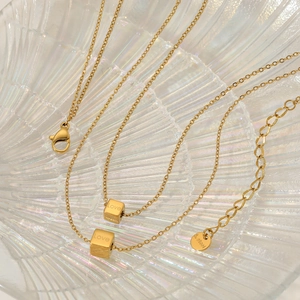 Minimalist double layer gold stainless steel necklace with Love cube pendants on pearl glass