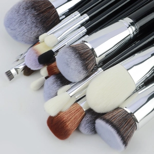 Close-up of 30pcs professional makeup brush set with synthetic bristles and black handles