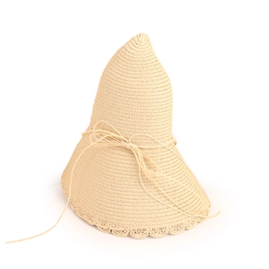 Detailed straw sun hat showing intricate wave edge and woven bow knot texture