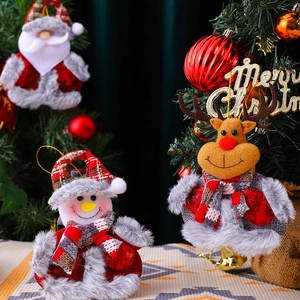 Plush Christmas tree ornaments set with Santa, Snowman and Reindeer on festive tablecloth