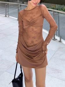 Detail of floral lace texture and ruched design on brown long sleeve top and mini skirt