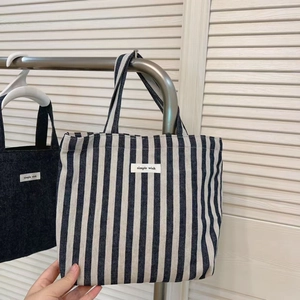 Detailed view of simple wish blue and white striped denim canvas lunch tote bag