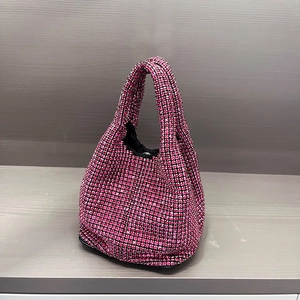 Detailed close-up of a sparkling pink rhinestone hobo bucket bag with a luxury crystal surface