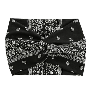 Elastic black paisley workout headband with cross-knot design for yoga and running