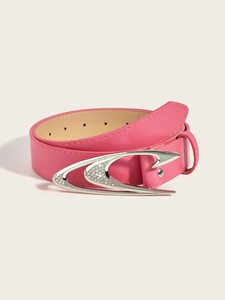 Detail of pink leather belt with rhinestone studded silver metal buckle on cream background