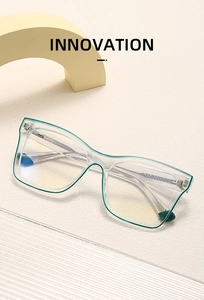 Detail of transparent green blue light blocking glasses on minimalist textured background
