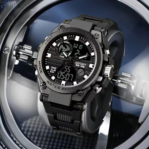 Detail of waterproof sport watch with dual display, luminous hands and black resin band
