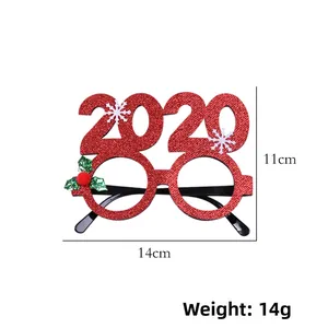 Close-up of red glitter Christmas glasses frame with 2020 numbers and size measurements