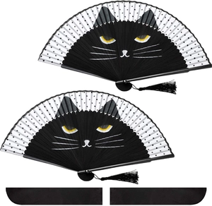 Detail of Japanese folding fans with black cat faces, white polka dots, and black tassels