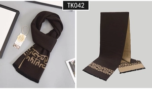 Detail of premium wool scarf with Greek key pattern and soft fringes for men