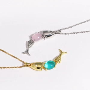 Articulated fish pendant necklace with blue and pink crystals in gold and silver finish