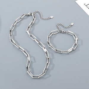 Detail of silver stainless steel paperclip and twisted rope chain necklace and bracelet set