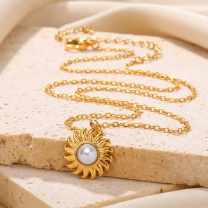 Golden sunflower pendant necklace with white pearl on elegant gold link chain for women