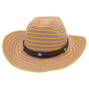 Detail of bohemian straw cowboy hat with purple yellow stripes and turquoise beads