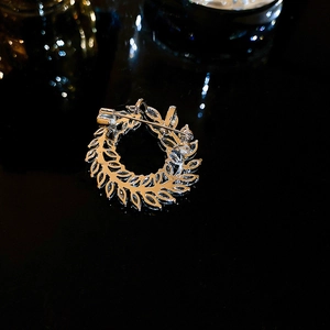Detail view of the silver leaf brooch back showing secure rotary pin and alloy structure