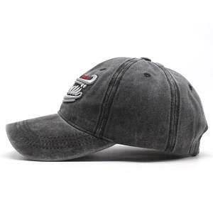 Close-up of vintage washed gray cotton baseball cap with 3D embroidery detail