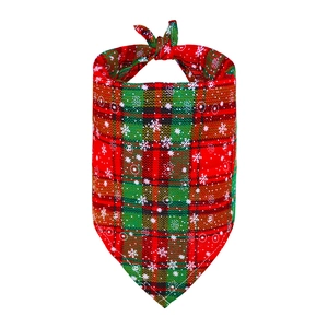 Plaid Christmas dog bandana with white snowflake patterns on classic red and green fabric
