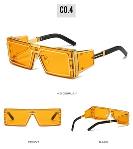 Detailed views of gold punk sunglasses with orange lenses and textured industrial side shields