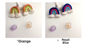 Macro view of handmade rainbow woven keychain charms with cotton fringe and colorful ropes