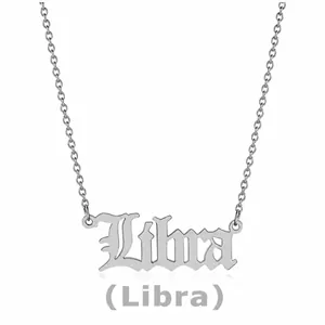 Detailed view of silver Libra zodiac pendant with gothic lettering on fine chain necklace