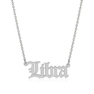 Detailed view of silver Libra zodiac pendant with gothic lettering on fine chain necklace