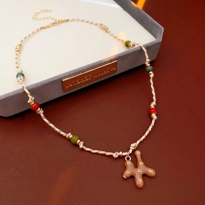 Handcrafted woven rope necklace with colorful ceramic beads and a puppy dog charm pendant