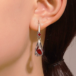 Silver drop earrings with red crystal stone and hollow rotating zircon design for weddings