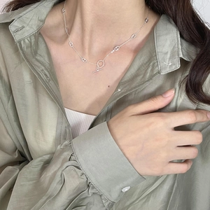 Minimalist 925 sterling silver necklace with pig nose links and T-bar toggle clasp on neck